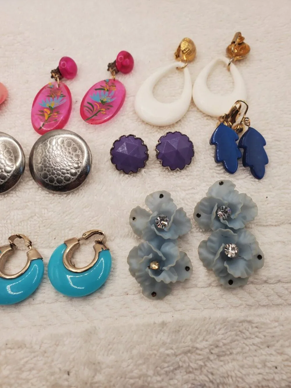 12 Pair of clip on earrings, items # B-2106-2117,.  wt. 123 grams.